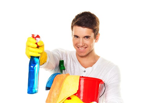 Team member using safe cleaning equipment and tidy workspace